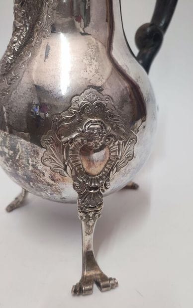 Silver tripod coffee pot, with scrolled feet...