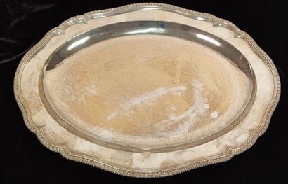 Two oval silver dishes with contours underlined...