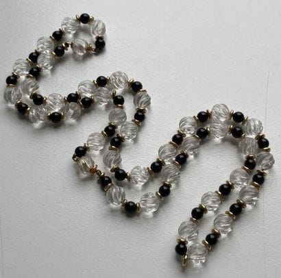 Long necklace and bracelet adorned with rock...