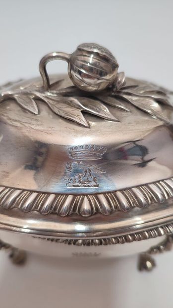 A quadripod sugar bowl with handles in silver...