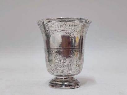 A silver tulip-shaped kettledrum decorated...