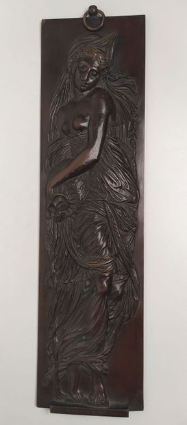 Bronze bas-relief of a woman with a jug
Signed...