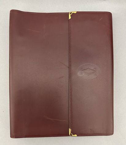Must by CARTIER
Two large burgundy leather...