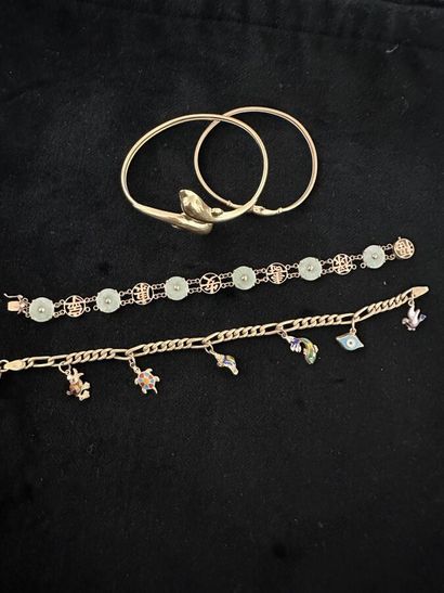 Two rigid bracelets in low-title yellow gold...