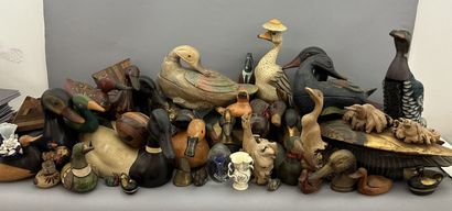 A set of wooden, metal and ceramic ducks,...