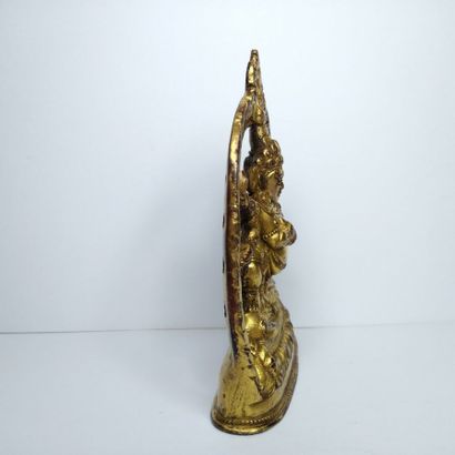 TIBET, 20th century 
Three gilded bronze...