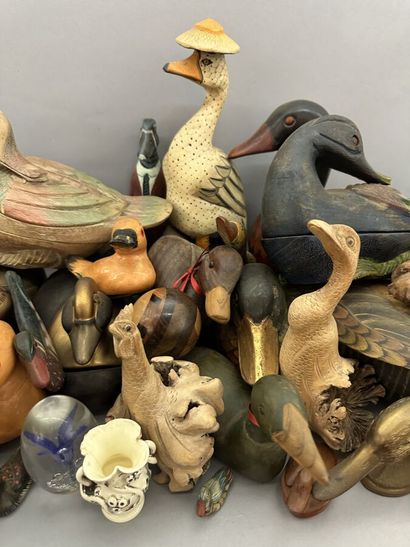 A set of wooden, metal and ceramic ducks,...