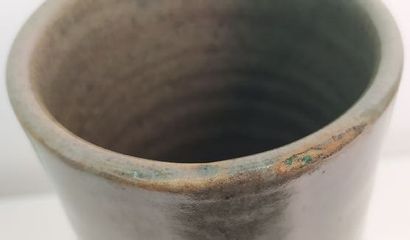 CHINA 
High-necked green celadon-glazed porcelain...