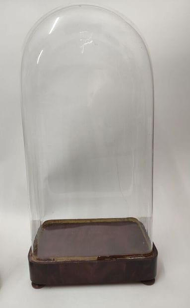 Set of three glass globes, wooden base 
one...