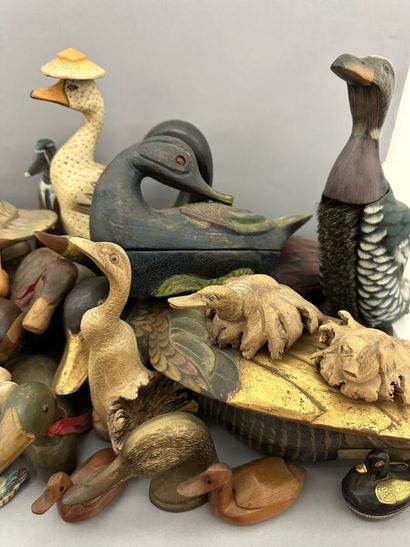 A set of wooden, metal and ceramic ducks,...