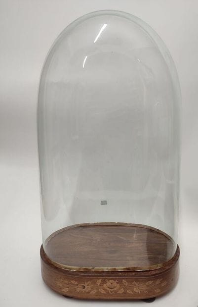 Set of three glass globes, wooden base 
one...