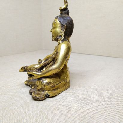 TIBET, 20th century 
Three gilded bronze...