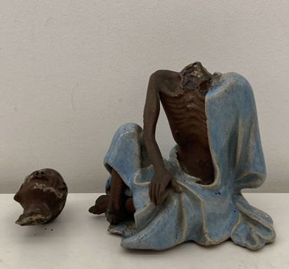 Stoneware figure, blue enamel tunic
Height...