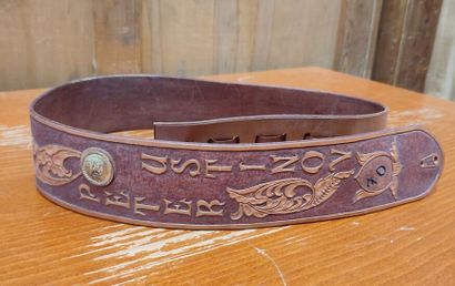 Leather belt with floral decoration and 