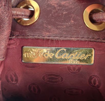 CARTIER PARIS burgundy purse-style bag 
(worn...