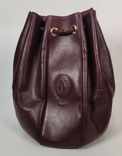CARTIER PARIS burgundy purse-style bag 
(worn...