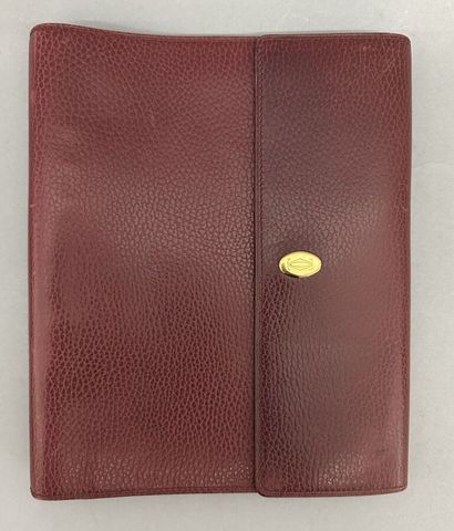 Must by CARTIER
Two large burgundy leather...