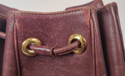 CARTIER PARIS burgundy purse-style bag 
(worn...