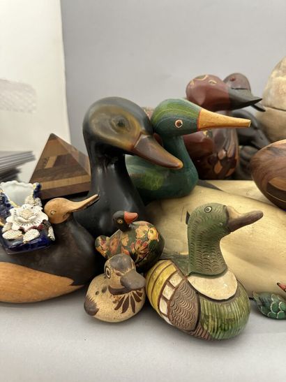 A set of wooden, metal and ceramic ducks,...