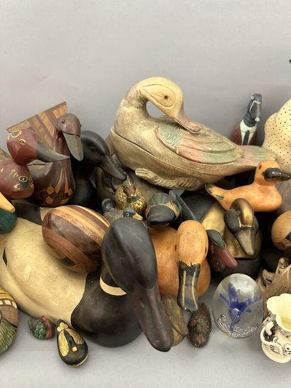 A set of wooden, metal and ceramic ducks,...