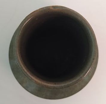 CHINA 
High-necked green celadon-glazed porcelain...