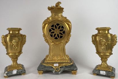 Chased and gilded bronze mantel set decorated...