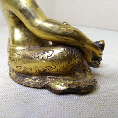 TIBET, 20th century 
Three gilded bronze...
