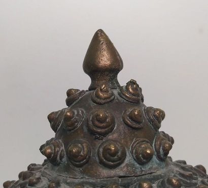 Gilded bronze Buddha head, adorned with an...