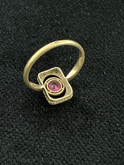 18K yellow gold ring set with a pink stone...