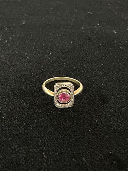 18K yellow gold ring set with a pink stone...