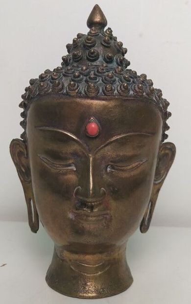 Gilded bronze Buddha head, adorned with an...