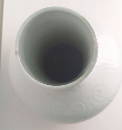 CHINA
White enameled porcelain vase with...