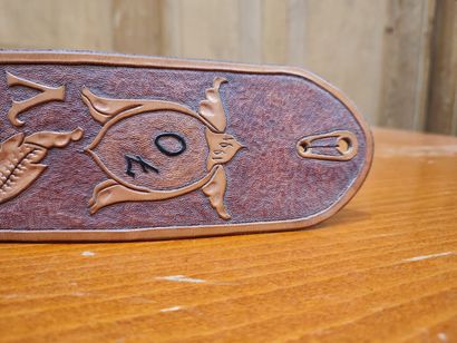 Leather belt with floral decoration and 