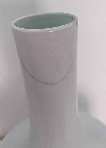 CHINA
White enameled porcelain vase with...