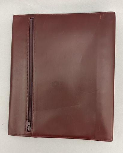 Must by CARTIER
Two large burgundy leather...