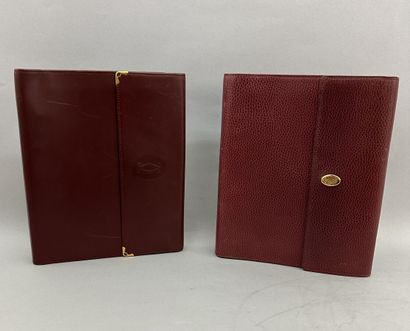 Must by CARTIER
Two large burgundy leather...