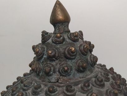 Gilded bronze Buddha head, adorned with an...