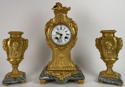 Chased and gilded bronze mantel set decorated...