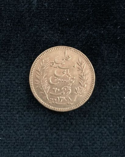 A 20-dinar Arabic gold coin, worn and rubbed

Lot...