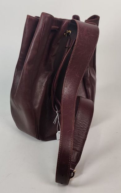 CARTIER PARIS burgundy purse-style bag 
(worn...