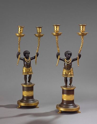 Paire de candélabres en bronze doré et patiné,...