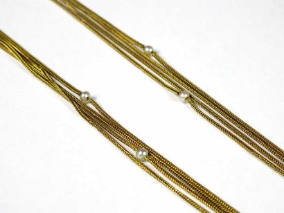 Collier souple quatre rangs en or jaune 18K,...