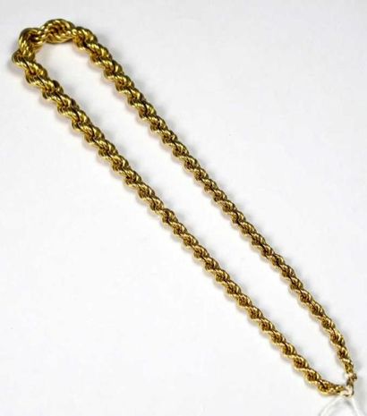 Collier souple en or jaune 18K, à décor de...