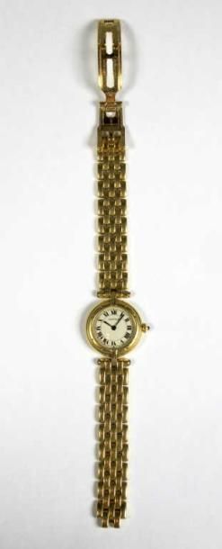 CARTIER
Montre-bracelet de dame en or jaune...