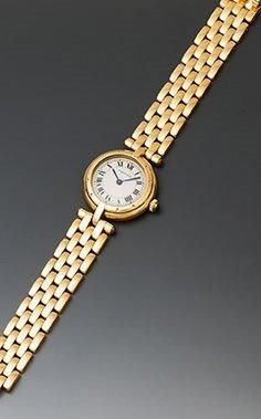 CARTIER
Montre-bracelet de dame en or jaune...