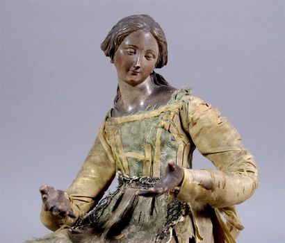 Santon napolitain figurant une femme assise,...
