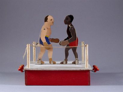 BOXE
Boxeurs sur le ring, dont Marcel Thyl
Jouet...