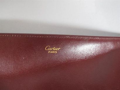 CARTIER Paris
Pochette en cuir bordeaux,...