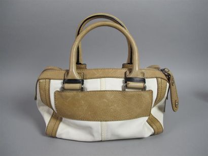 CHLOÉ
Sac porté main en cuir beige et toile...