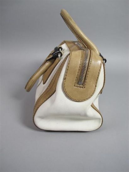 CHLOÉ
Sac porté main en cuir beige et toile...